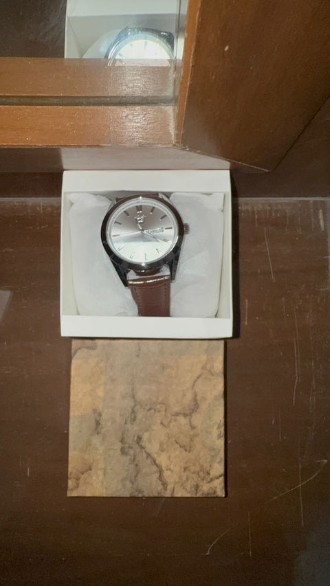 Title Carera watch  With black strap and lock and black dile