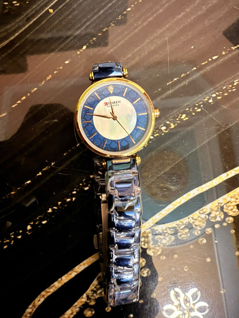 Curren watch women with black dile and blue dile