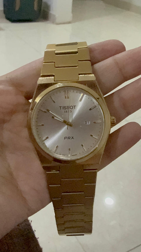 Tissot with full golden chain semi automatic and white dile